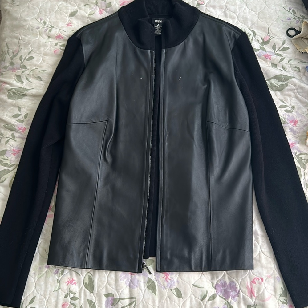 Two in one! Has leather and woven material, to give a cozy but sharp look
